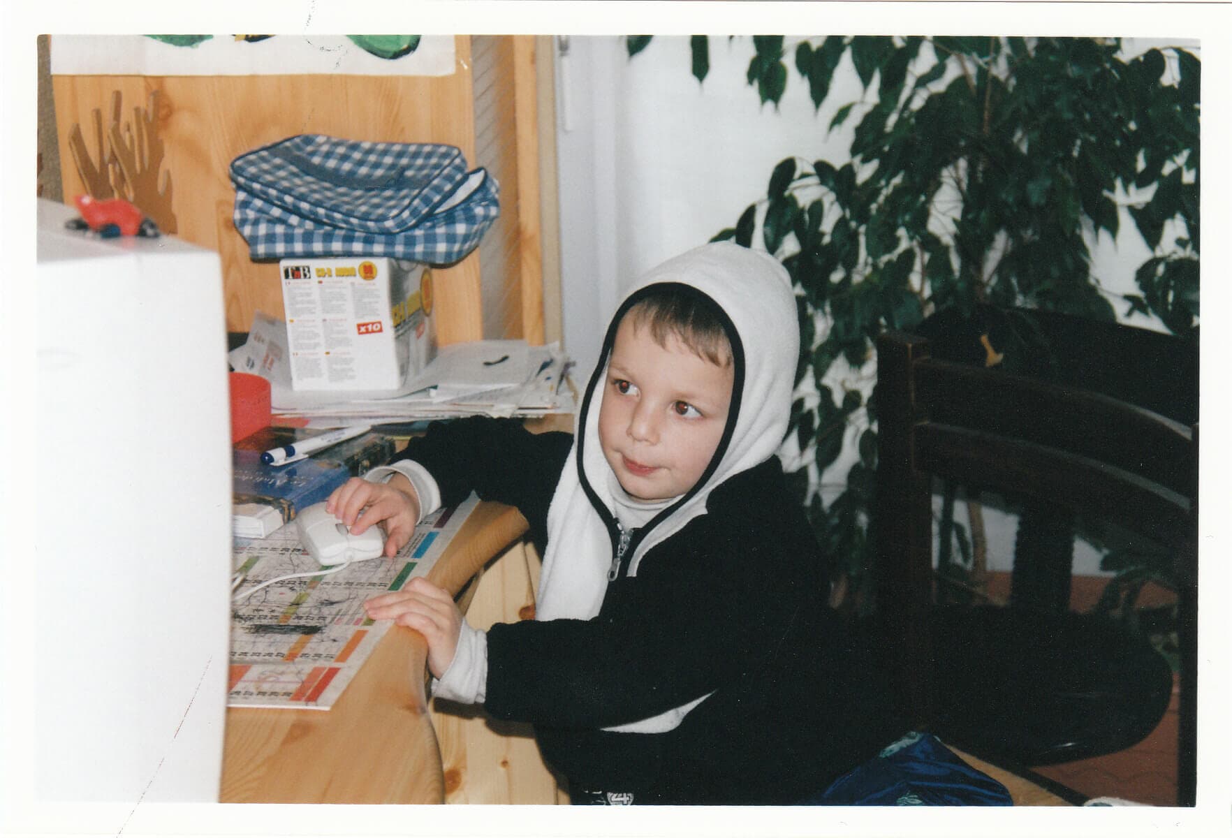 Nathan as a child in front of a computer